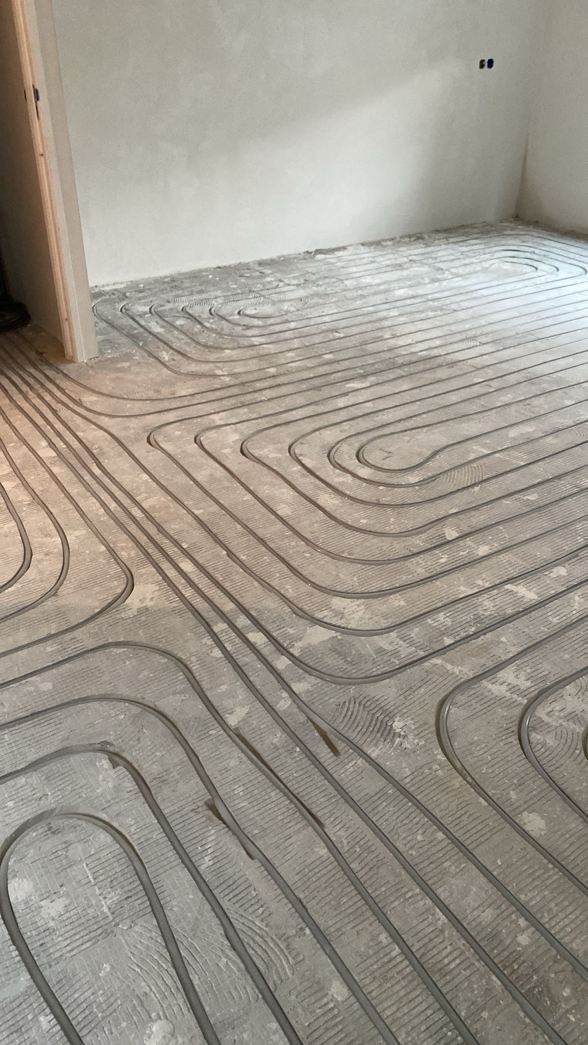 Vloerverwarming met thermostaatregeling per zone
