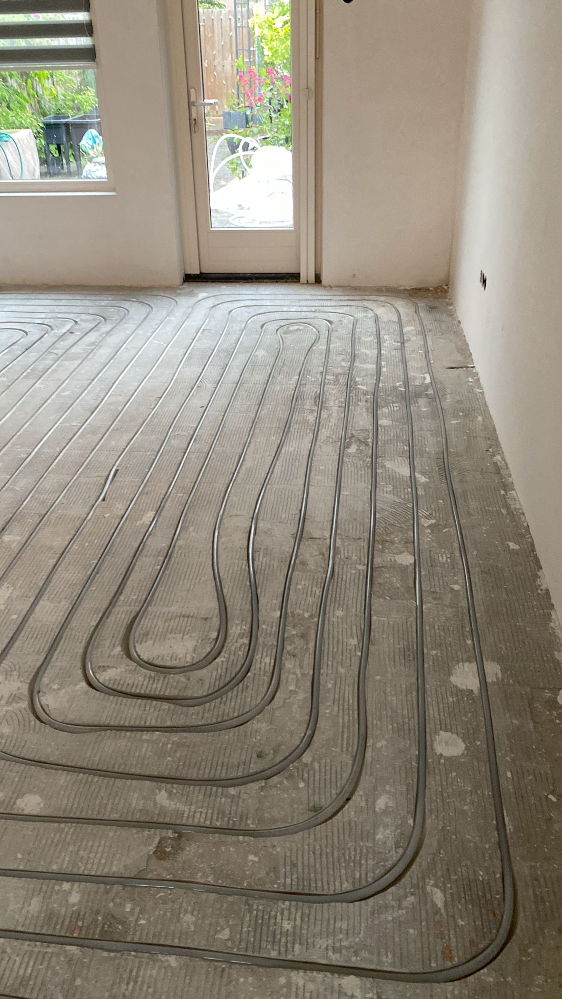 Installatie vloerverwarming in woonkamer
